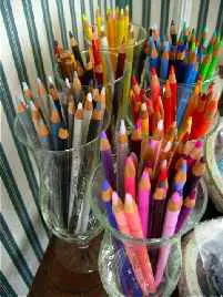 jars of colorful artists pencils