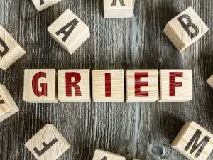 Wooden blocks that spell grief