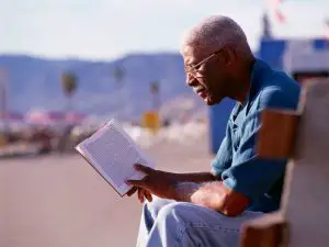 Man reading a grief and loss book