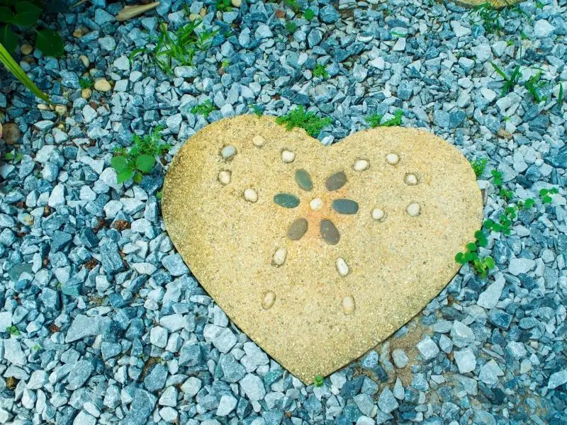 Gravel path with a heart shaped stepping stone