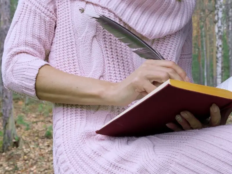 Woman writing in a notebook