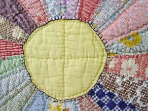 Quilt with a sun in the middle